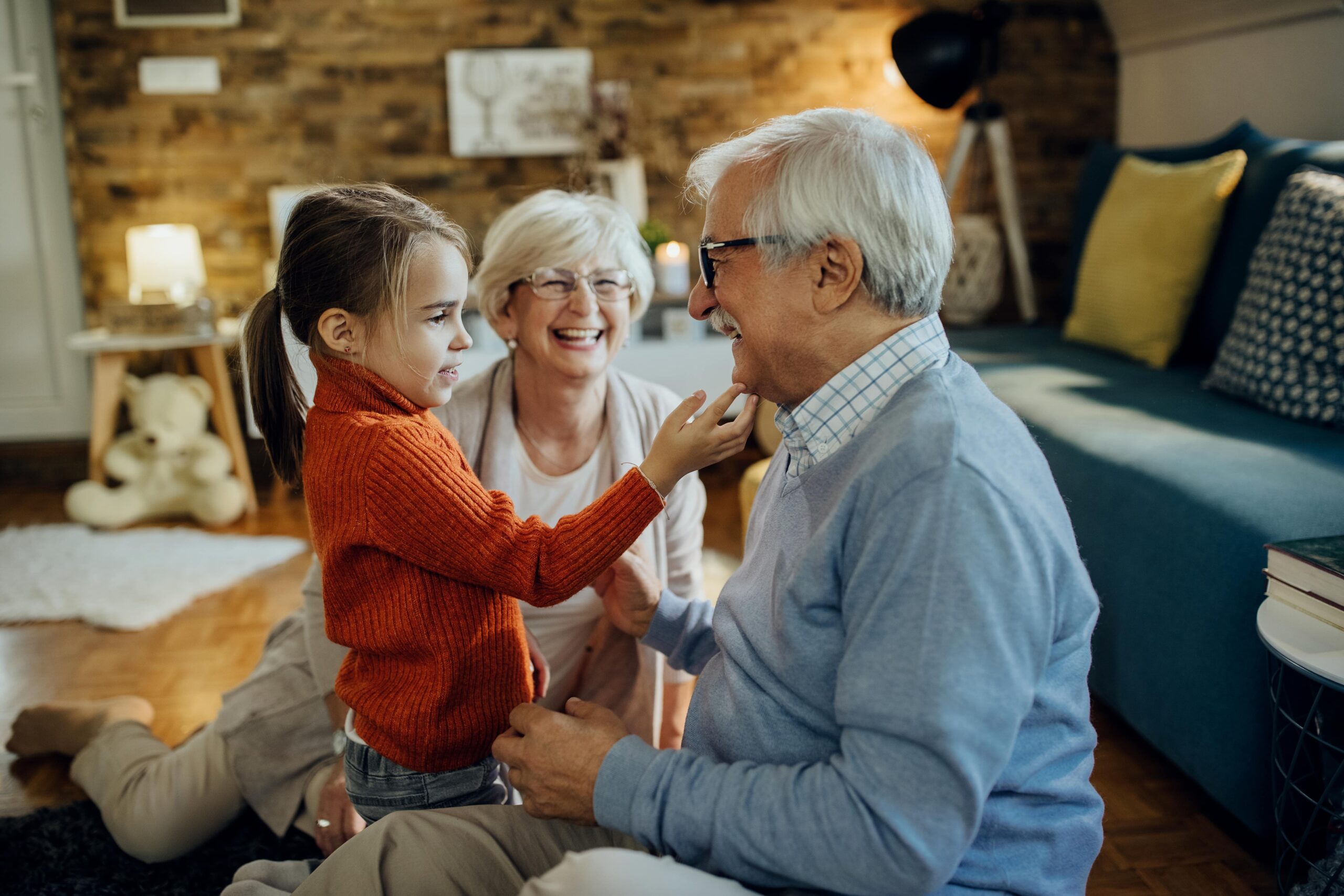 cute-small-girl-spending-time-with-her-grandparents-home-min